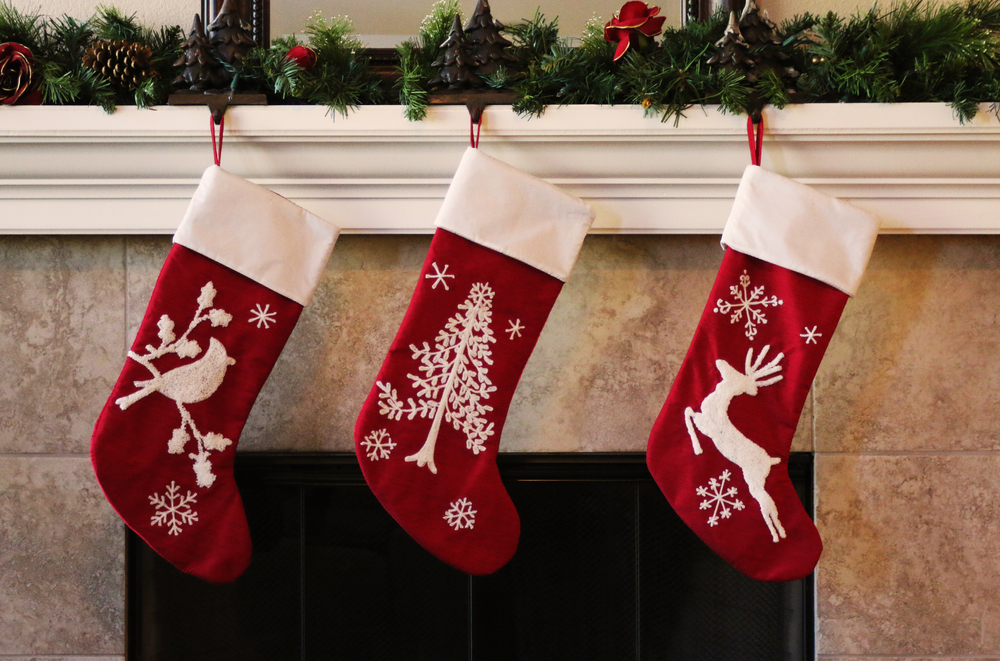 christmas stockings hanging from fireplace in winter for holiday festive decor season safely from fireplace to prevent fires and keep home safe with safety tips