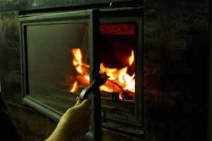 opening a glass fireplace door